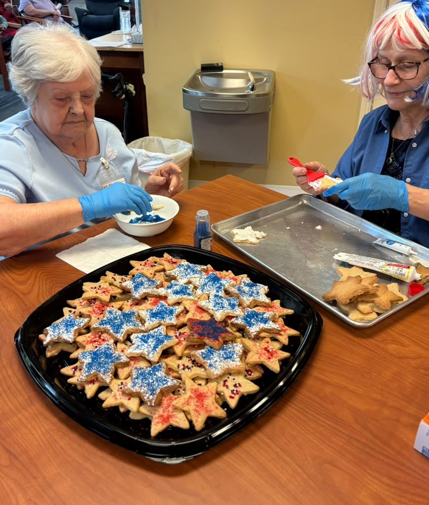 Participants decorating star-shaped cookies
