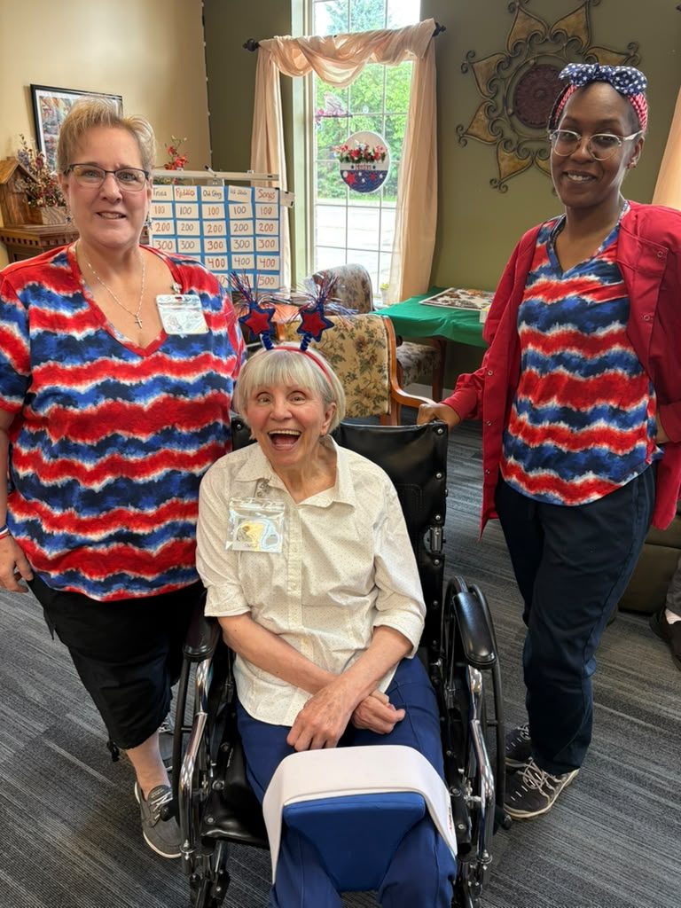 Staff and a participant dressed in red, white, and blue