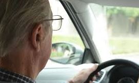 Senior man driving a car